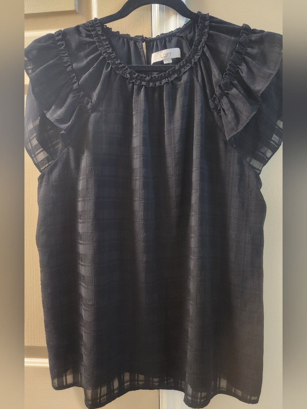 Loft black short-sleeve blouse featuring a subtle textured checker pattern